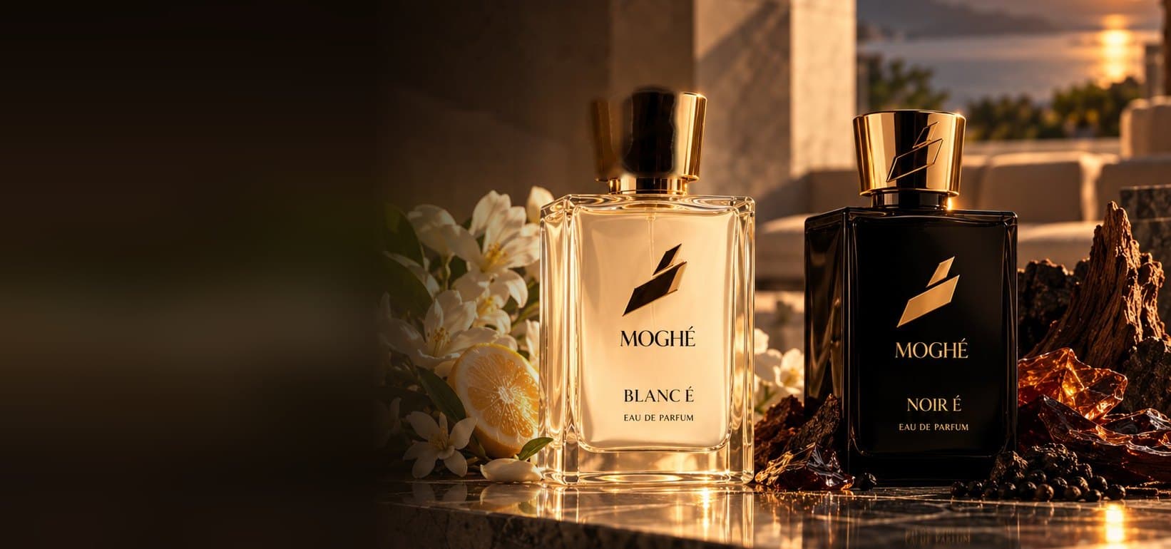 BLANC É and NOIR É on a marble ledge with white flowers and amber